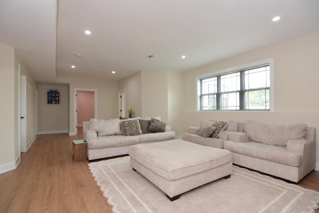 living room with light hardwood / wood-style floors