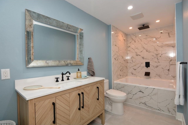 full bathroom with toilet, tile patterned floors, tiled shower / bath, and vanity