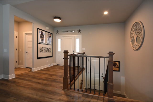 hallway with dark wood-type flooring