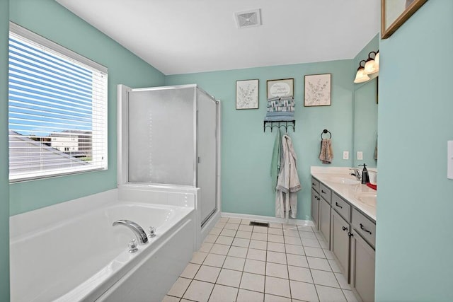 bathroom with independent shower and bath, tile patterned flooring, and vanity