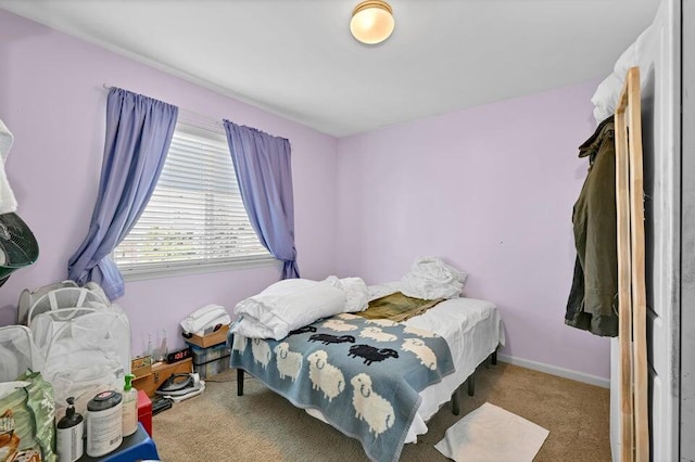 bedroom featuring light colored carpet