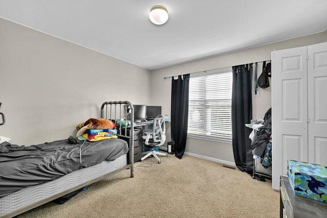 bedroom with light colored carpet