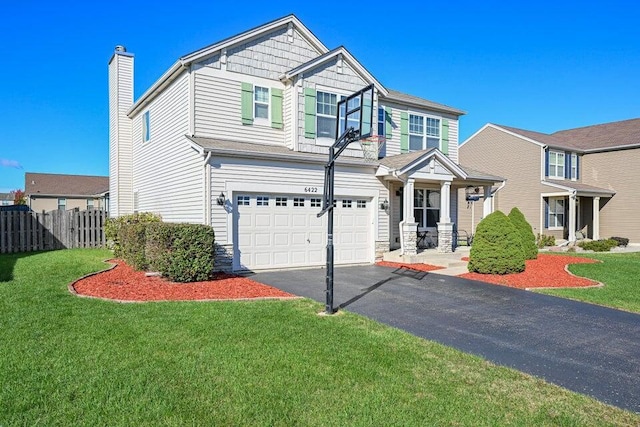 view of front facade featuring a front lawn and a garage