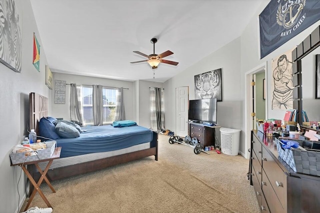 bedroom with light carpet, ceiling fan, and vaulted ceiling