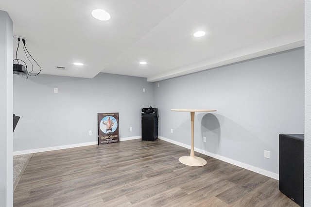 workout room featuring hardwood / wood-style flooring