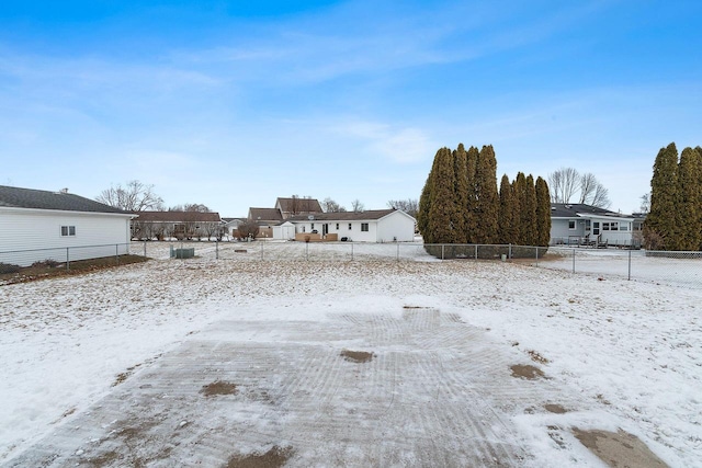 view of yard layered in snow