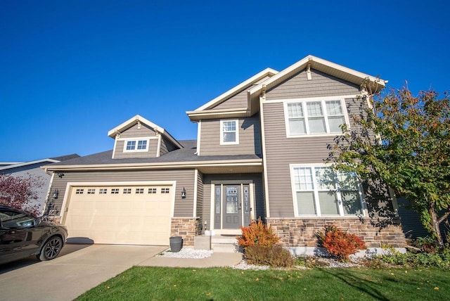 craftsman house with a garage, stone siding, and concrete driveway