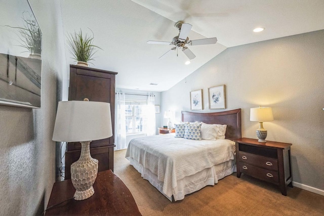 carpeted bedroom featuring ceiling fan and lofted ceiling