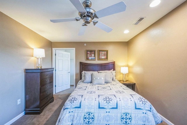 bedroom with ceiling fan and dark colored carpet