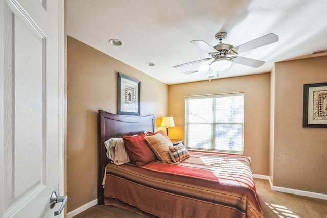 carpeted bedroom featuring ceiling fan