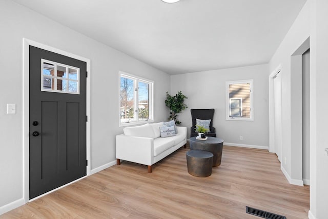 foyer with light wood-type flooring