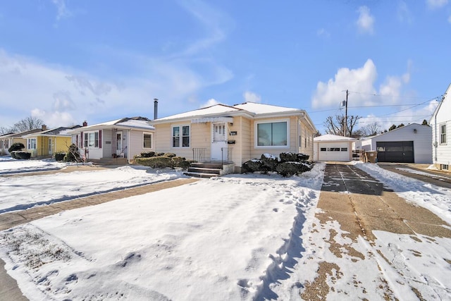 view of front of property featuring an outbuilding and a garage