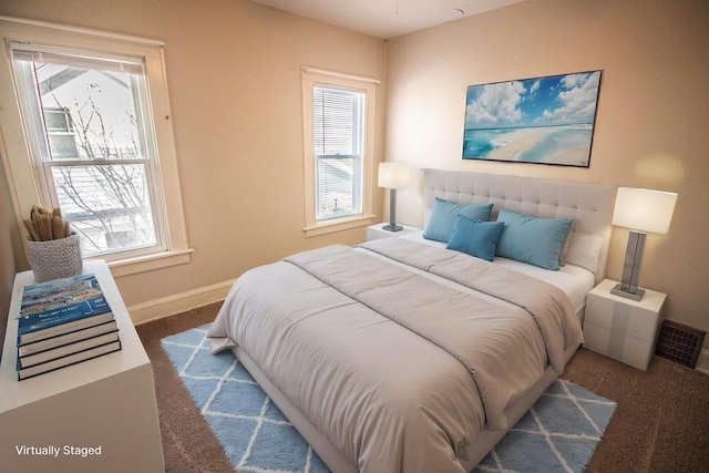 bedroom featuring dark carpet