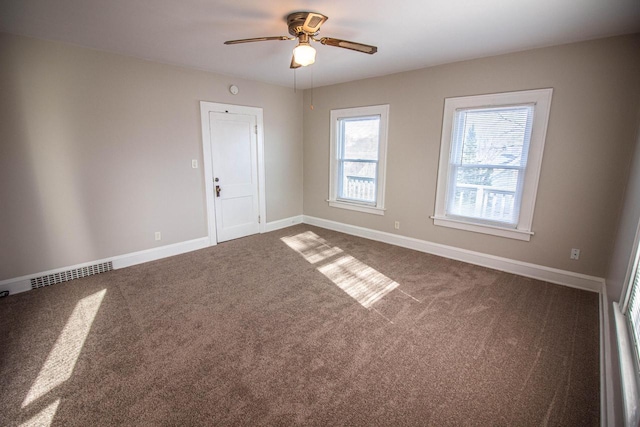 carpeted empty room with ceiling fan