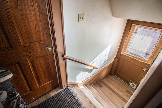 stairway featuring hardwood / wood-style flooring