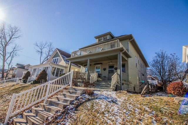 view of front of home with a balcony and covered porch