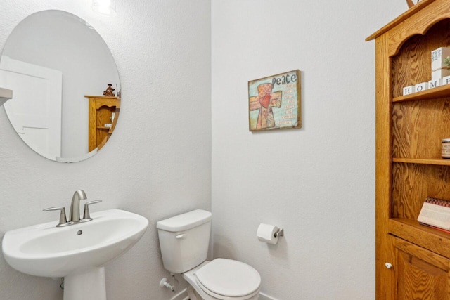 bathroom with toilet and sink