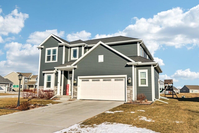 view of front of home featuring a front lawn and a garage