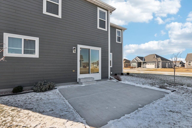 rear view of house with a garage