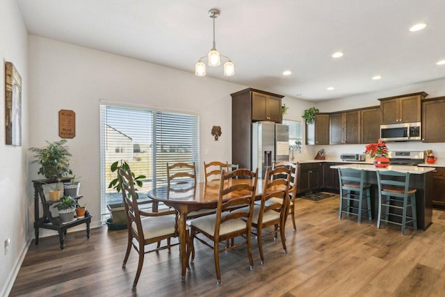 dining room with hardwood / wood-style flooring