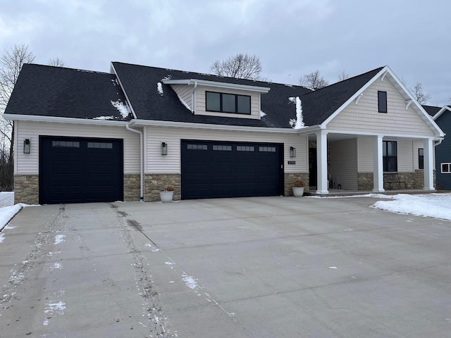 view of front of home featuring a garage and a porch