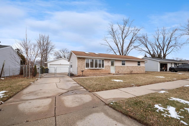 single story home featuring a garage, a front lawn, and an outdoor structure