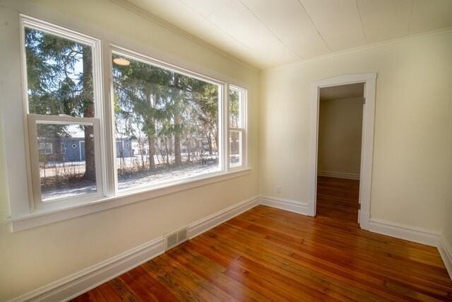 spare room with dark wood-type flooring