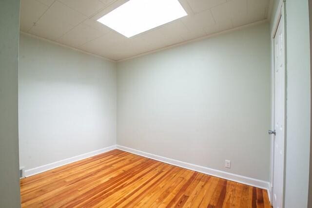 spare room featuring hardwood / wood-style flooring