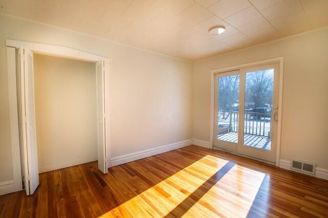 spare room featuring dark hardwood / wood-style floors