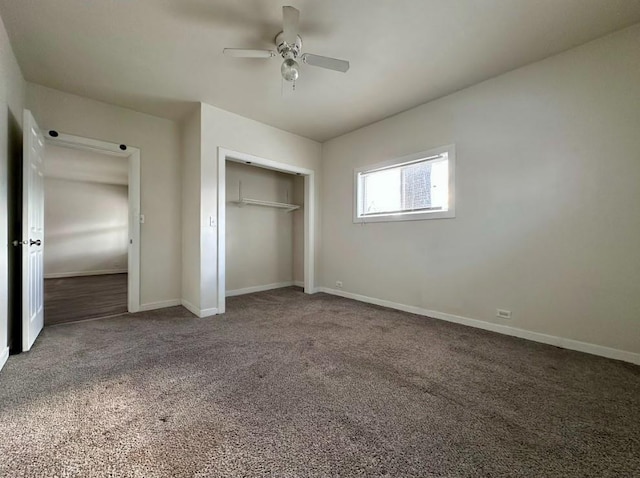 unfurnished bedroom with ceiling fan, carpet, and a closet