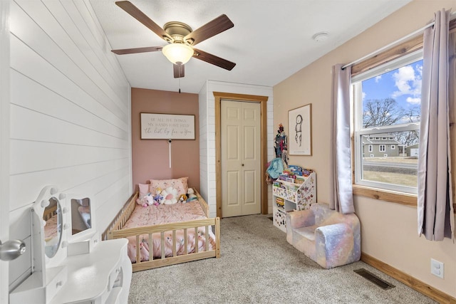 bedroom with ceiling fan and carpet