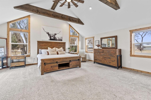 bedroom with ceiling fan, beam ceiling, light carpet, and multiple windows