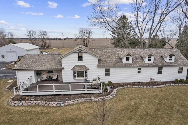 back of house featuring a deck and a yard