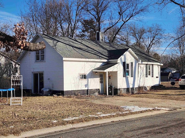 view of side of home featuring a trampoline