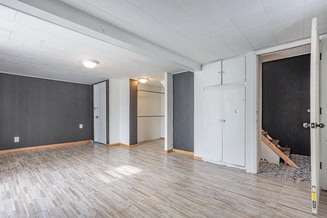 unfurnished bedroom with beam ceiling