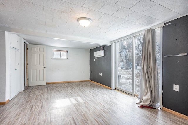 spare room with plenty of natural light and light hardwood / wood-style floors