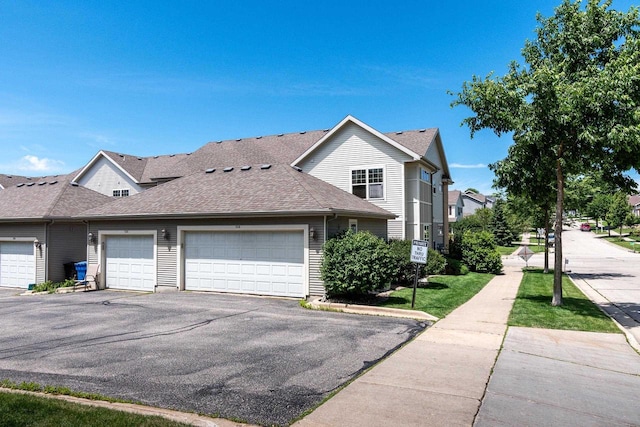 view of side of property with a garage