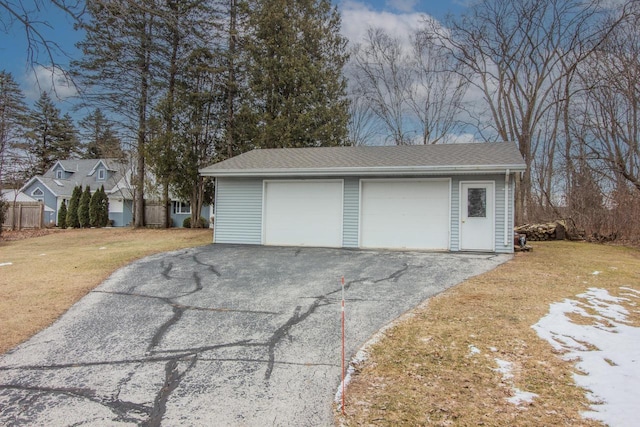 garage with a lawn