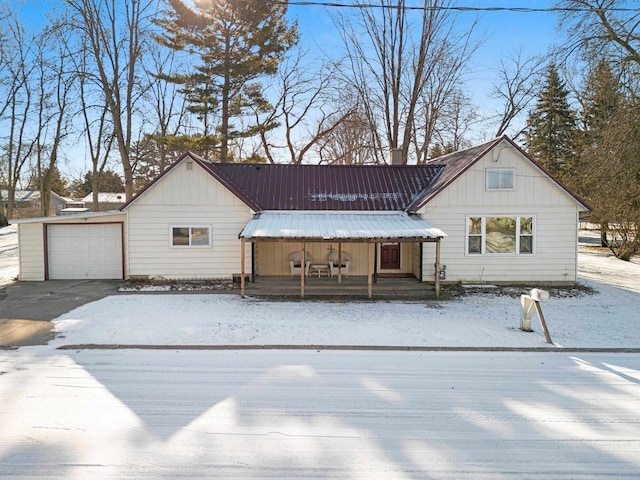 view of front of house featuring a garage and a porch