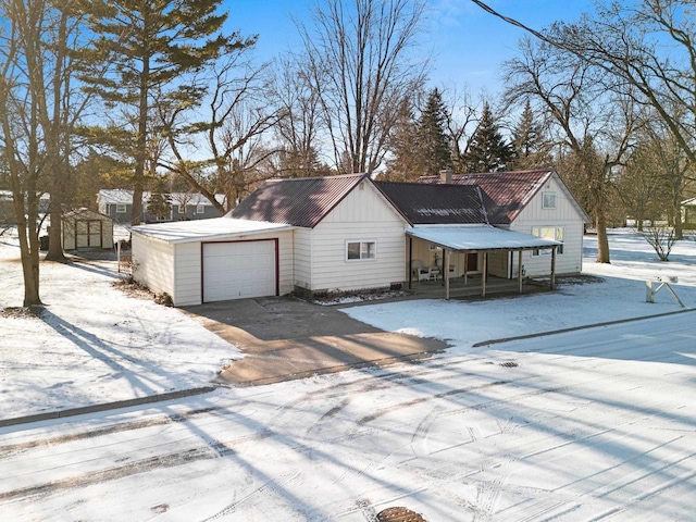 view of front of home featuring a storage shed