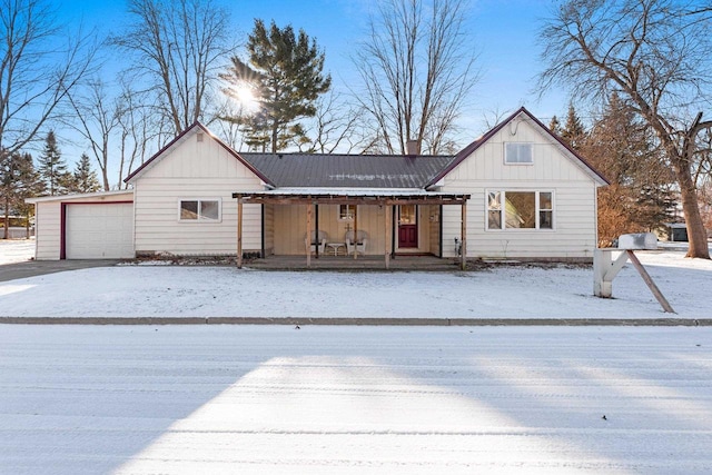 view of front of home with a porch and a garage