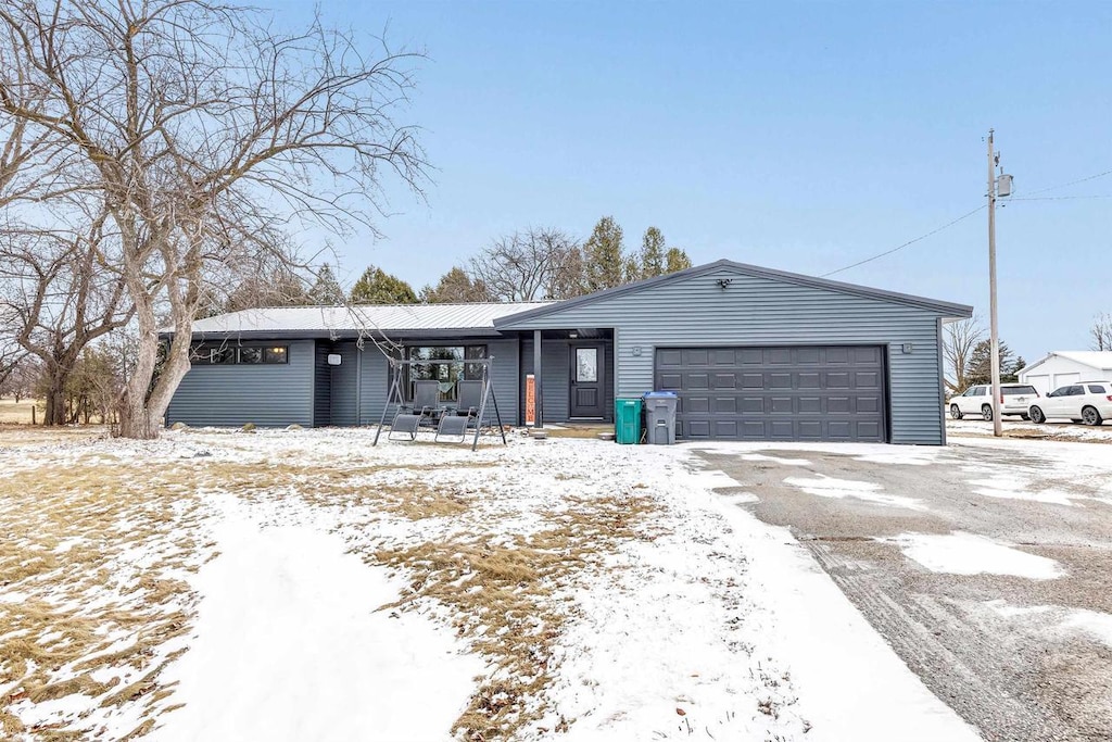 ranch-style home with a garage