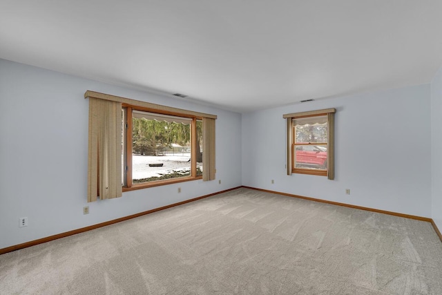 empty room with light colored carpet