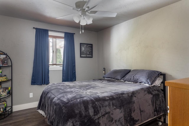 bedroom featuring ceiling fan and dark hardwood / wood-style floors