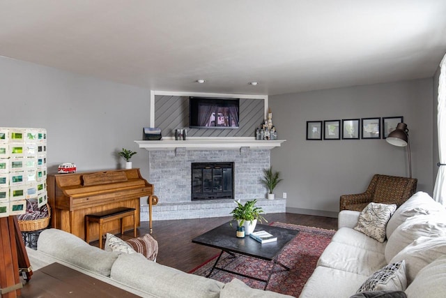 living room with a fireplace and hardwood / wood-style floors