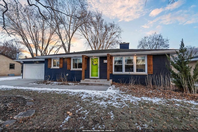 ranch-style house featuring a garage