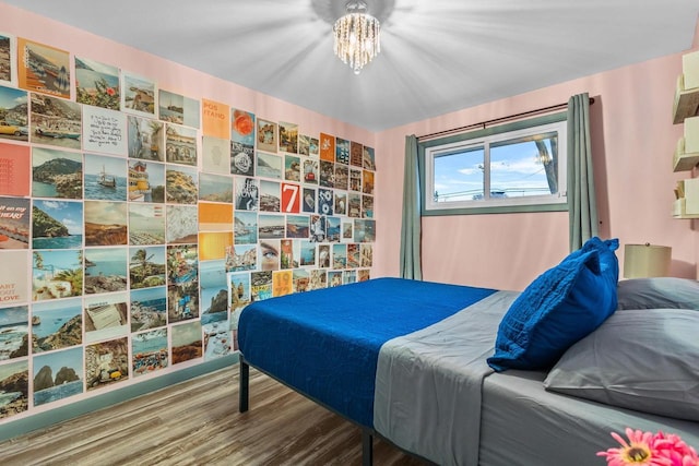 bedroom with hardwood / wood-style flooring