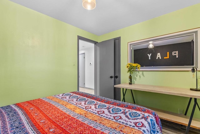 bedroom with hardwood / wood-style floors