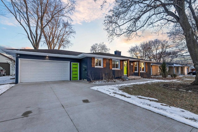 single story home featuring a garage