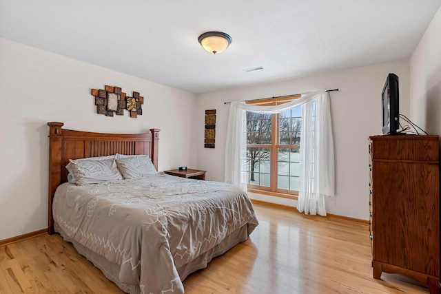 bedroom featuring light hardwood / wood-style floors